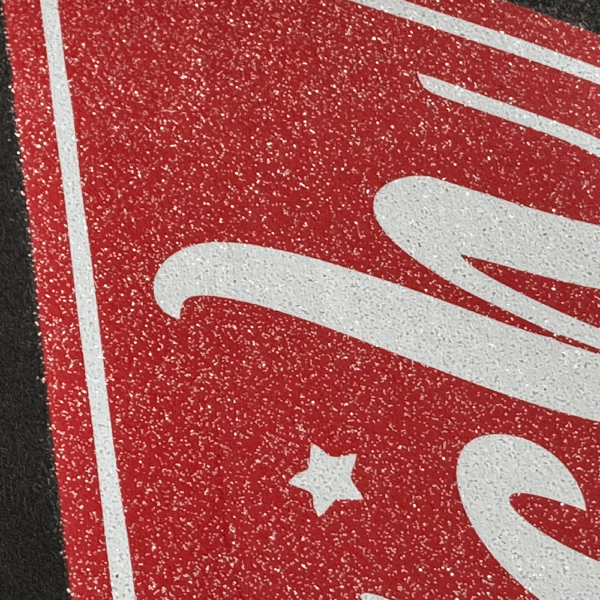Close-up of glitter DTF film showing shimmer and sparkle in direct-to-film print